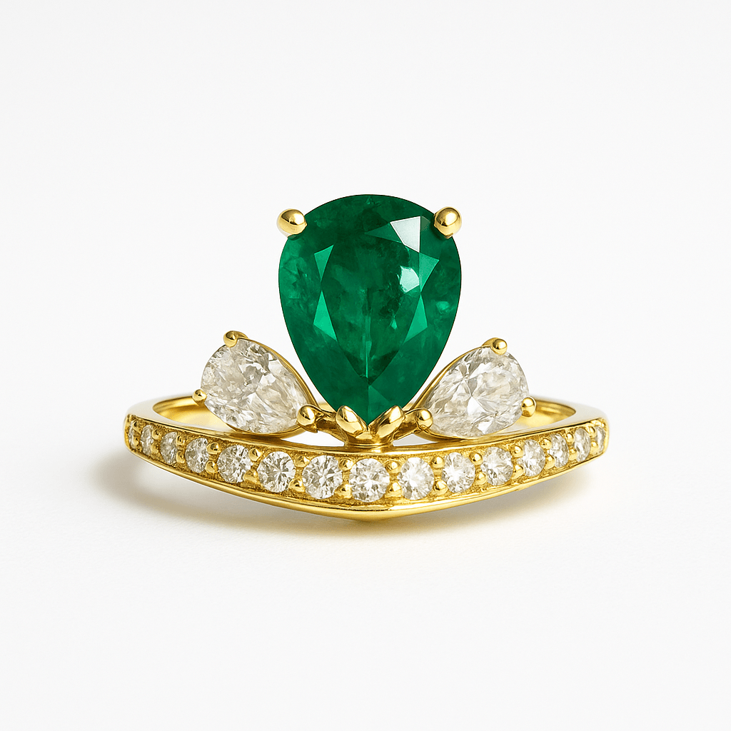 Emerald Diamond Crown Ring featuring a pear-shaped emerald centerpiece with diamond accents on a gold band. Princess Crown Jewelry for elegant occasions.