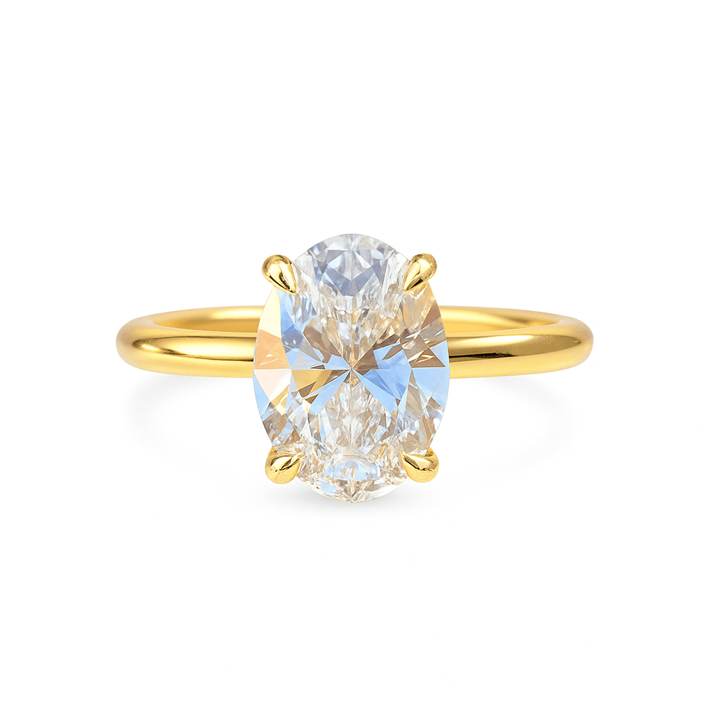 Front view of yellow gold engagement ring with a large oval cut lab grown VVS1 diamond, perfect for a bold and elegant proposal.