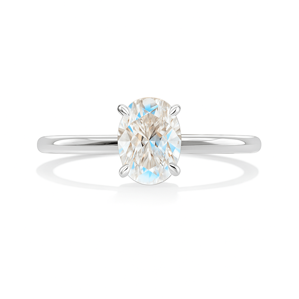 Lab grown oval diamond engagement ring in platinum with a sleek solitaire band, showcasing VVS1 clarity and modern sophistication.