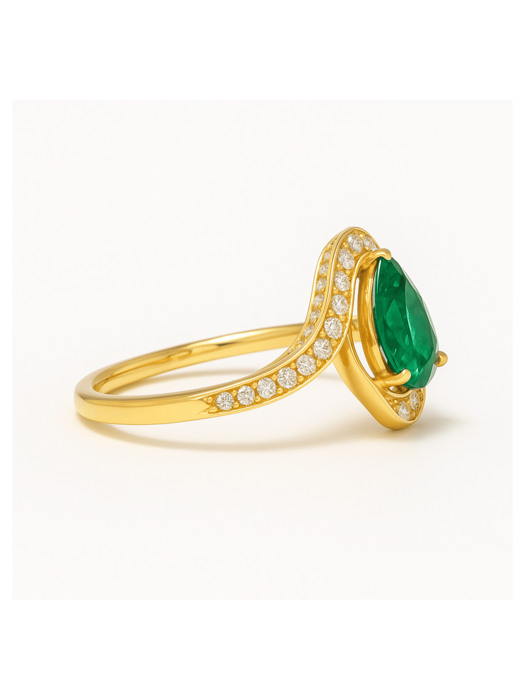Emerald Gold Ring featuring Egyptian Eye design with pear-cut emerald and diamond-studded gold band. Elegant jewelry for timeless style.