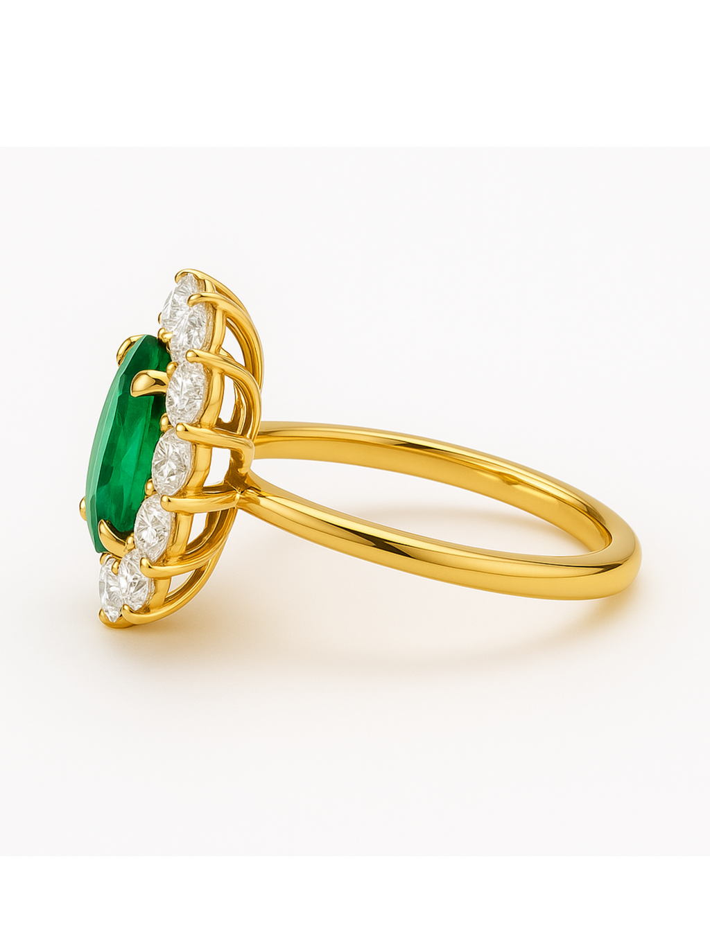 Emerald Diamond Gold Ring with oval-cut emerald center and diamond cluster on gold band. Elegant oval design for fine jewelry collections.