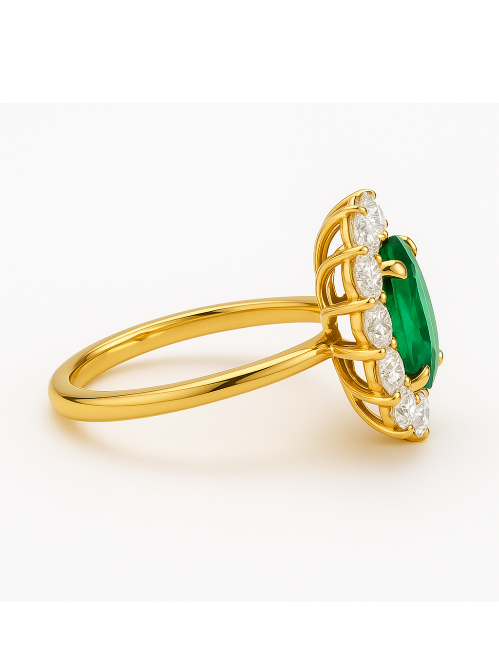 Emerald Diamond Gold Ring with oval-cut emerald center and diamond cluster on gold band. Elegant oval design for fine jewelry collections.