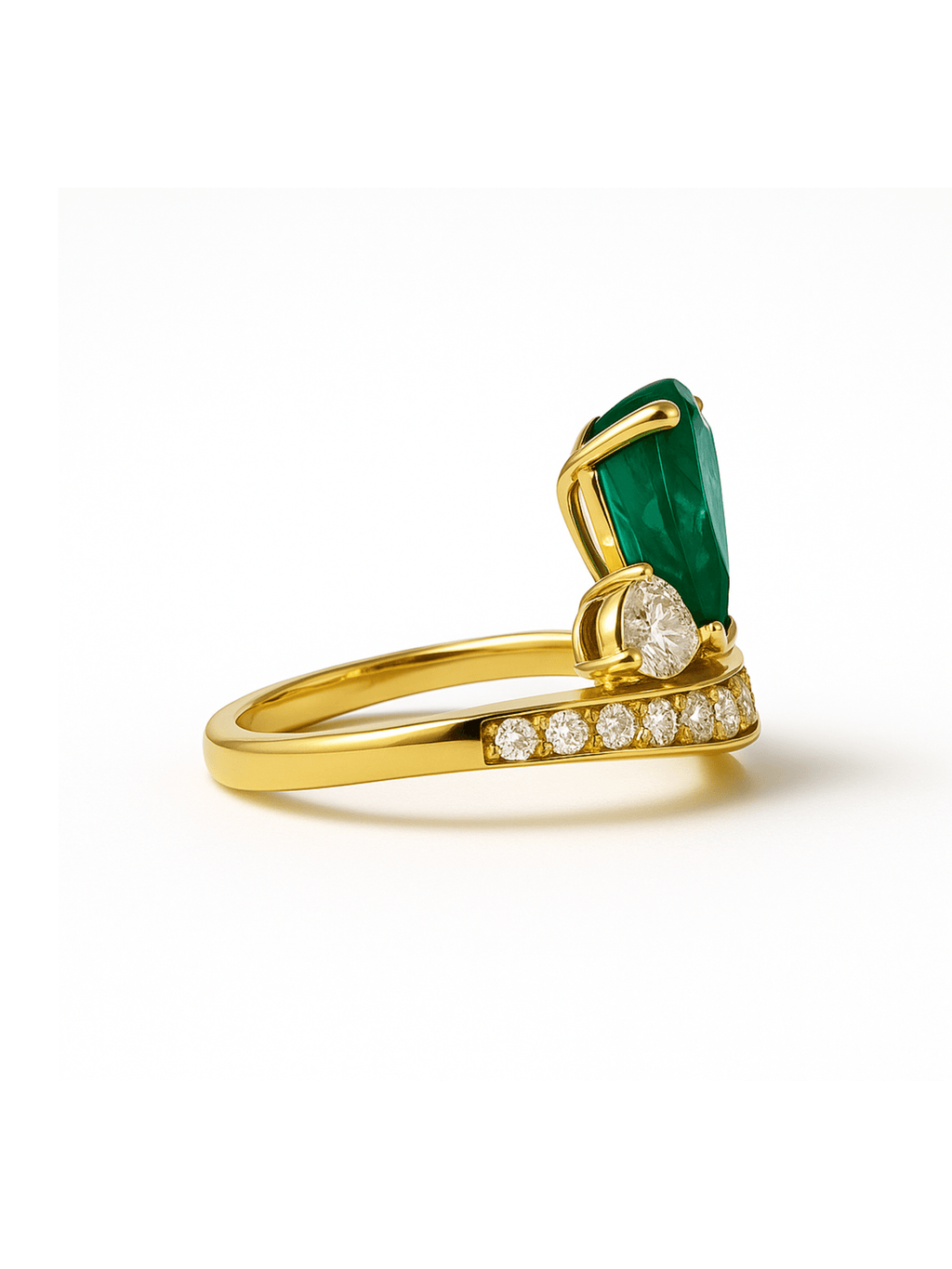 Emerald Diamond Crown Ring with princess crown design featuring a large emerald centerpiece and accent diamonds on a gold band. Ideal for luxury jewelry lovers.