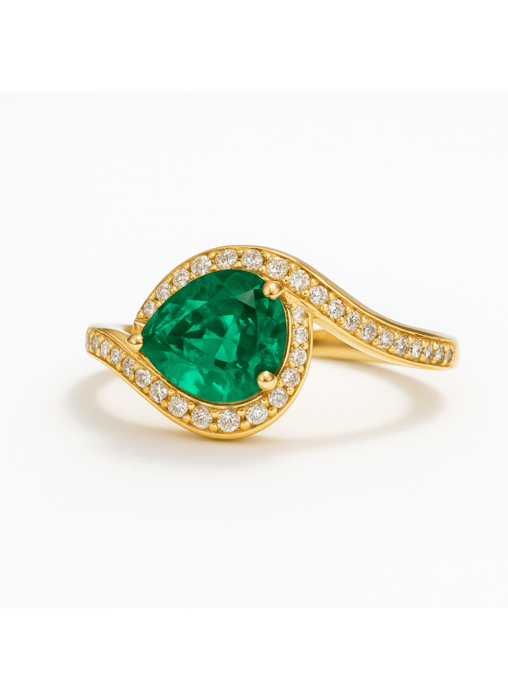 Emerald Gold Ring with Egyptian Eye design featuring a pear-shaped emerald center stone and diamond accents on a gold band. Unique jewelry piece for elegance.