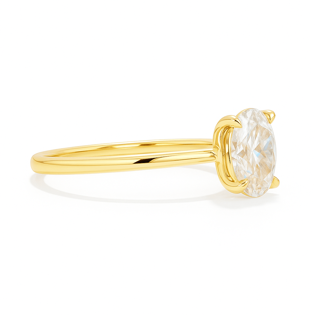 Elegant profile of lab grown oval diamond ring in yellow gold, highlighting the slim band and secure four-prong setting.
